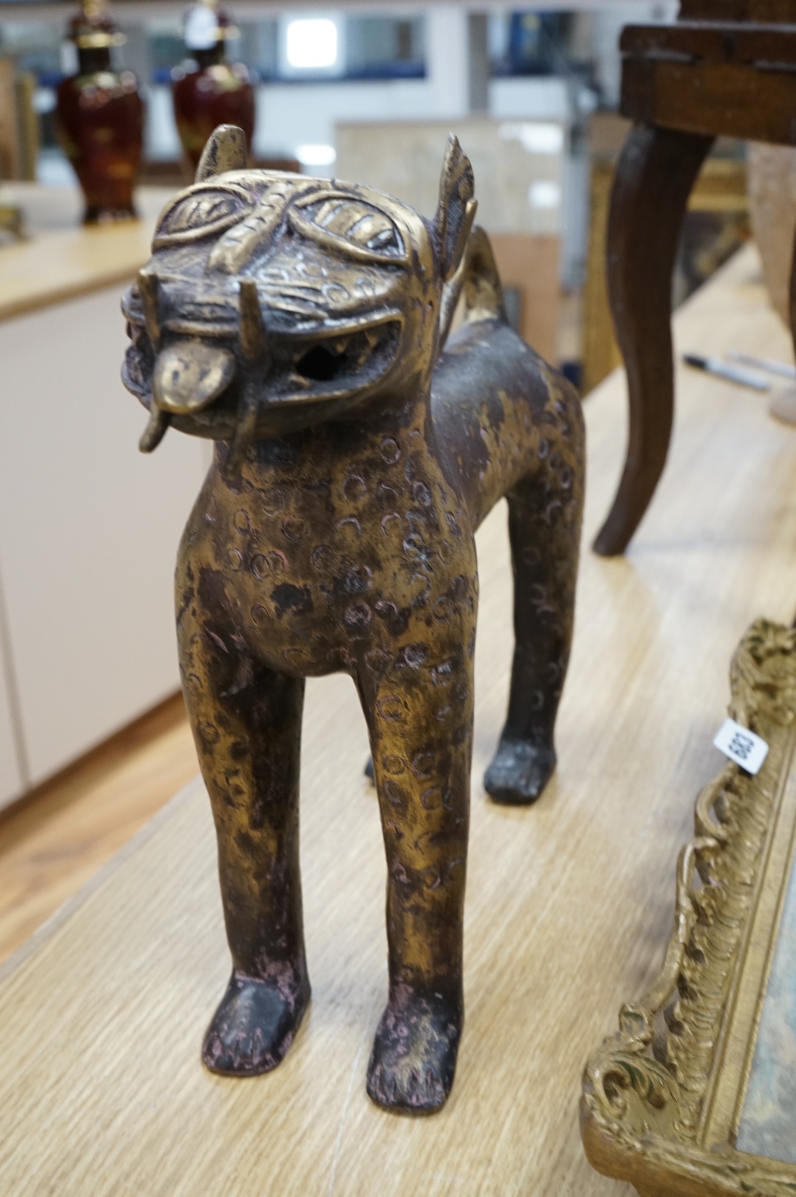 An African Benin style bronze model of a leopard, 37cm x 33cm
